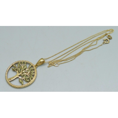 1069 - A silver gilt Tree of Life pendant and chain with black diamond acent