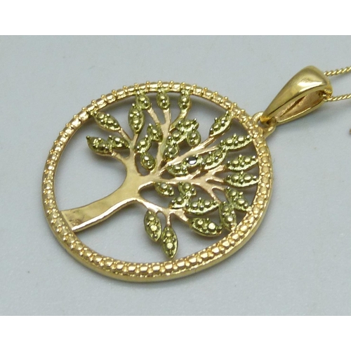 1069 - A silver gilt Tree of Life pendant and chain with black diamond acent