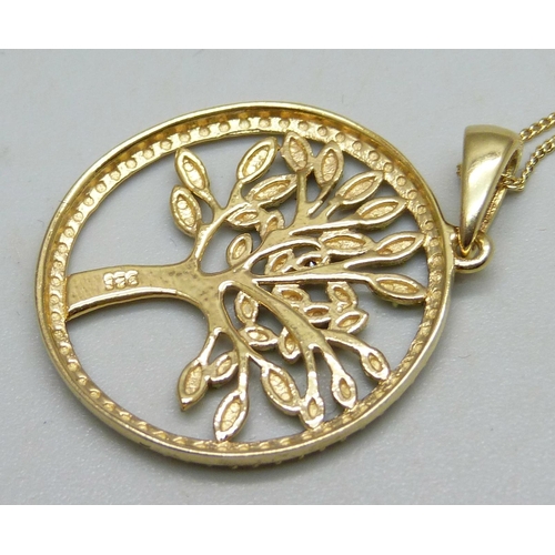 1069 - A silver gilt Tree of Life pendant and chain with black diamond acent