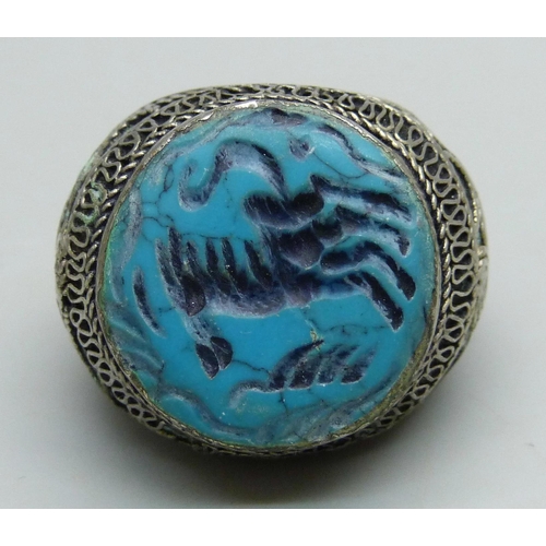 1070 - A large Islamic metal and blue stone seal ring