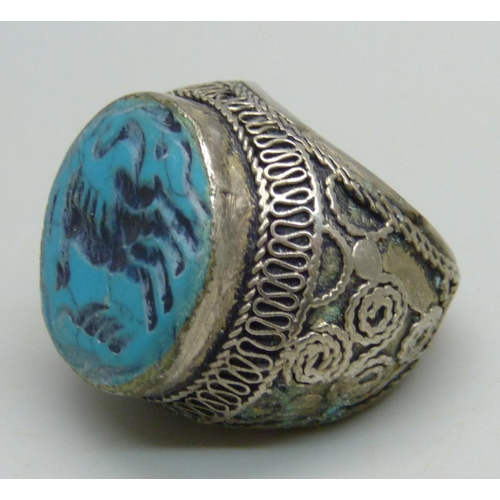 1070 - A large Islamic metal and blue stone seal ring