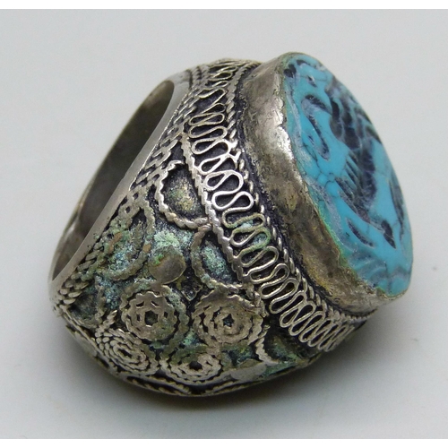 1070 - A large Islamic metal and blue stone seal ring