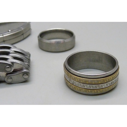 1074 - Three gentleman's stainless steel bracelets and two rings