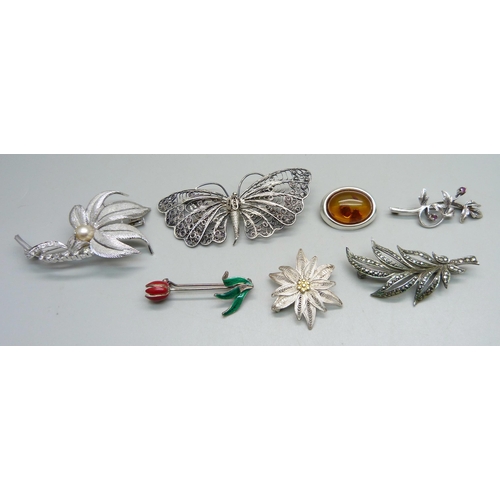 1077 - Seven white metal brooches, three marked as silver (all test as silver), 45g