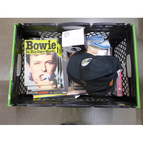 1105 - Two boxes of music related memorabilia including David Bowie merchandise, baseball caps, sweat bands... 