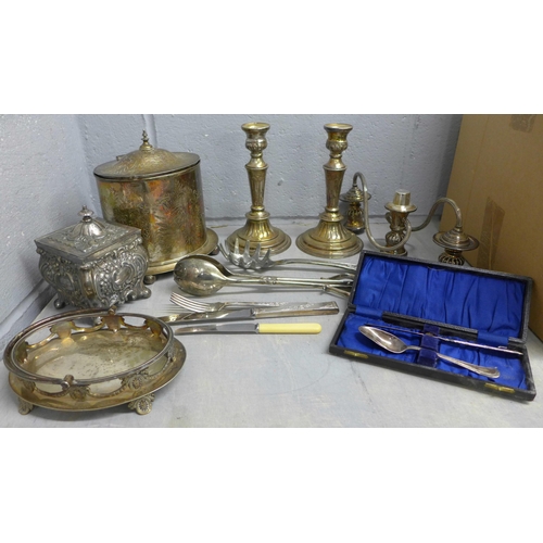 1108 - A collection of silver plated items including a Britannia tea caddy, condiment holder, tongs, and a ... 