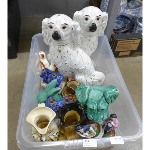 1148 - A pair of Staffordshire spaniels, two Toby jugs, two models of houses, a pair of miniature spaniels,... 