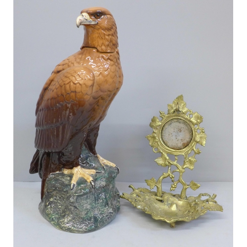 609 - A Royal Doulton Whyte & Mackay Golden Eagle decanter and a gilt watch stand