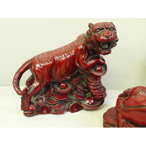 613 - Two Cinnabar coloured resin figures, tiger and toad and three resin figures of Immortals, one a/f