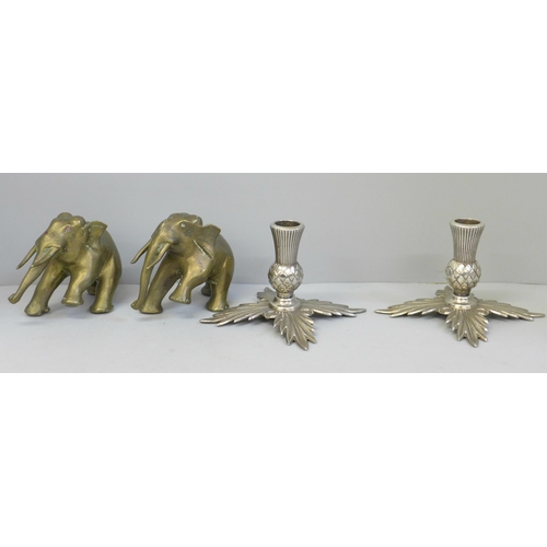 615 - A pair of plated thistle candlesticks and two brass model elephants