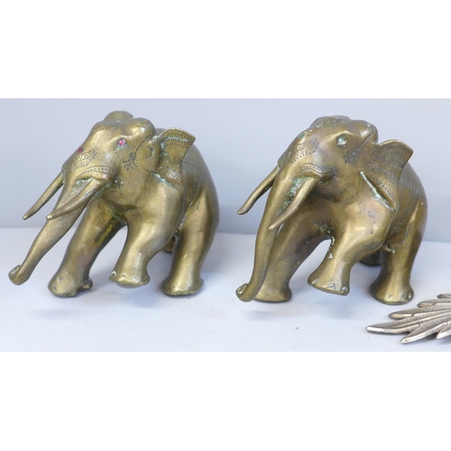 615 - A pair of plated thistle candlesticks and two brass model elephants