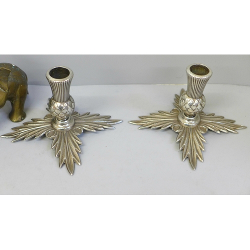 615 - A pair of plated thistle candlesticks and two brass model elephants