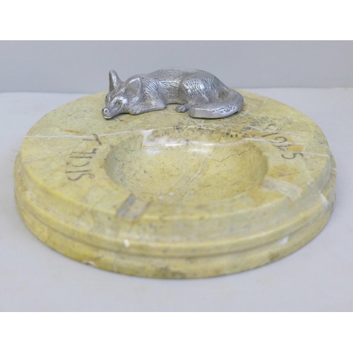 639 - A stone ash tray marked Sicily 1945, with a fox