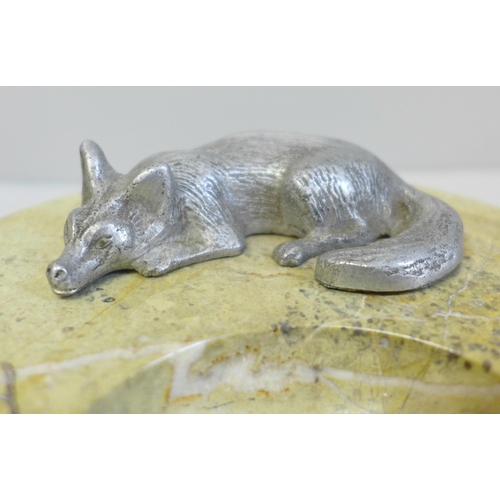 639 - A stone ash tray marked Sicily 1945, with a fox