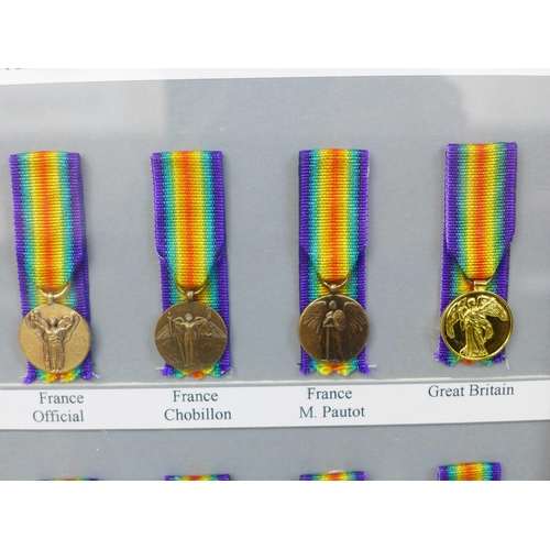 649 - A framed collection of sixteen Allied Victory Medals of WWI miniature medals