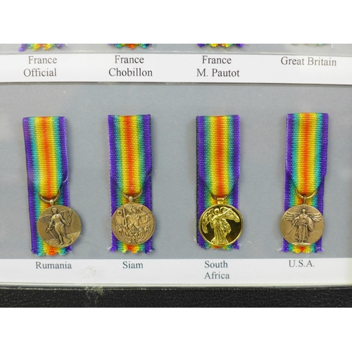 649 - A framed collection of sixteen Allied Victory Medals of WWI miniature medals