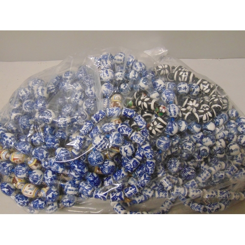 652 - Twenty-three Chinese style porcelain bead necklaces