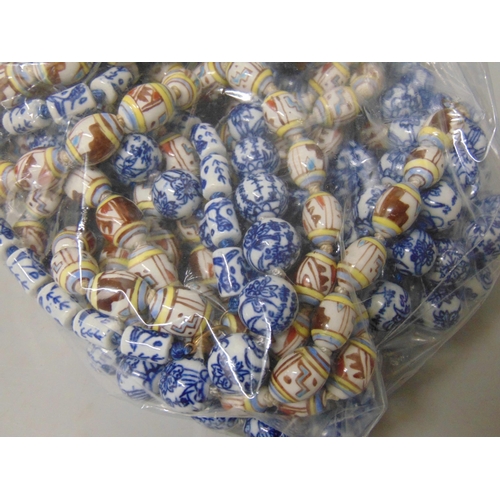 652 - Twenty-three Chinese style porcelain bead necklaces