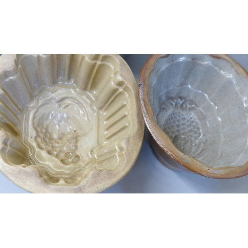 660 - A collection of five late 19th/early 20th Century ceramic jelly/blancmange moulds