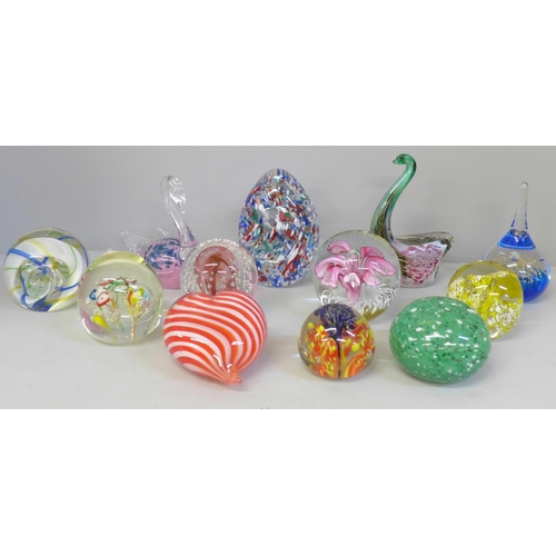 668 - A collection of twelve glass paperweights