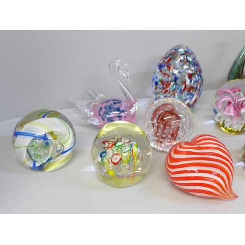 668 - A collection of twelve glass paperweights