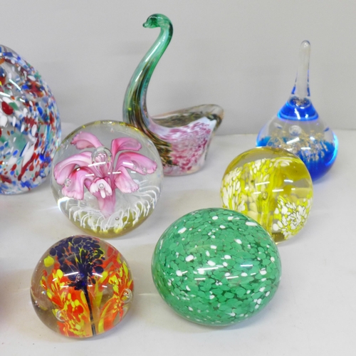 668 - A collection of twelve glass paperweights