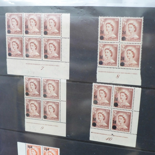 669 - Stamps; a folder of early Queen Elizabeth II complete with unmounted mint, many in blocks with impri... 