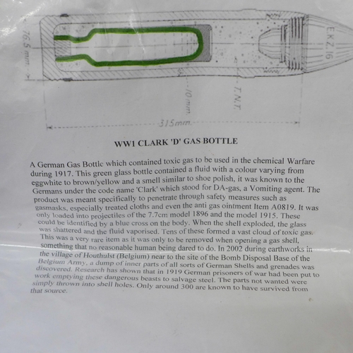 677 - A WWI Clark 'D' Gas bottle and one other heavy green glass bottle with etched Reichsadler and Swasti... 