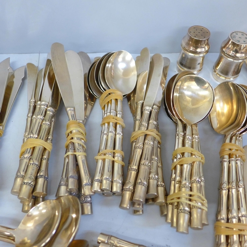 678 - A Thai brass cutlery set with bamboo form handles