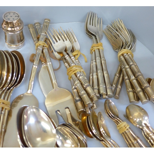 678 - A Thai brass cutlery set with bamboo form handles