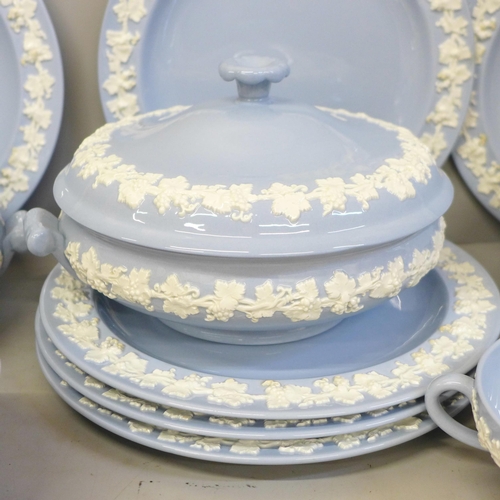 718 - A collection of Wedgwood of Etruria embossed Queen's Ware blue and white vine dinner and tea ware, t... 