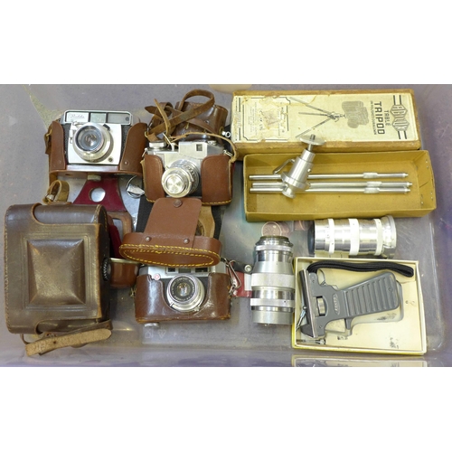 721 - A box of vintage photographic equipment; four cameras, a Komura 3.5 135mm lens, tripod and light met... 