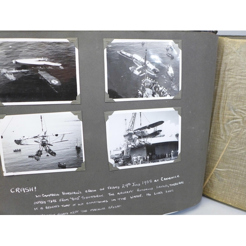 740 - A photograph album containing photographs of warships and Royalty, Suez Canal images, etc.