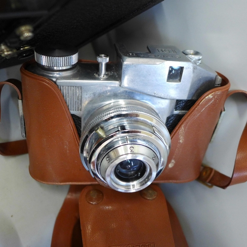 755 - A collection of vintage cameras and lenses including Comet II and Chinon