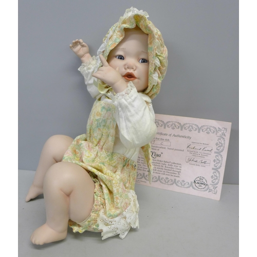 762 - An Edwin M Knowles limited edition 'piano baby' doll, boxed with certificate