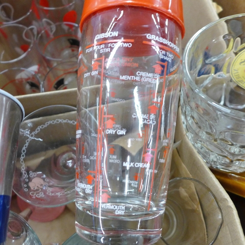 775 - A box of various vintage cocktail glasses, two cocktail shakers, cocktail sticks, one with recipes, ... 