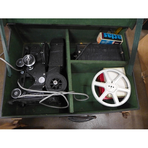 784 - Two early projectors (slide and Pathescope film) and film reels of Mickey Mouse and Charlie Chaplin ... 