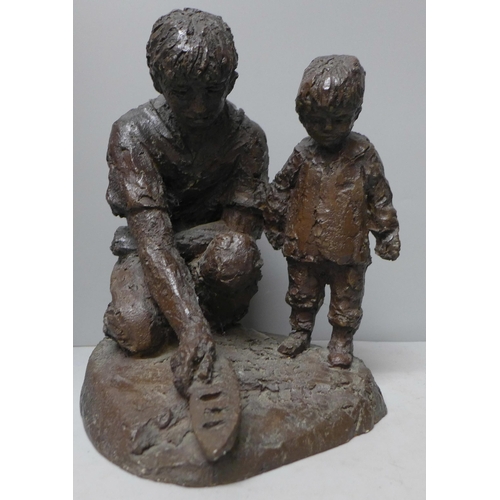 790 - Two Kari Java stone sculptures; father and son with mother and daughter, tallest 25cm **PLEASE NOTE ... 