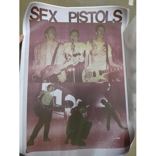 818 - A collection of approximately 50 film and music reproduction posters, many Sex Pistols