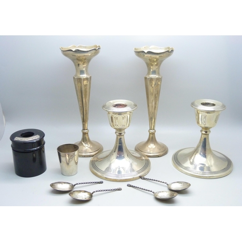 844 - A pair of silver candlesticks, a pair of silver vases, four silver spoons, a/f, an 830 shot and a si... 