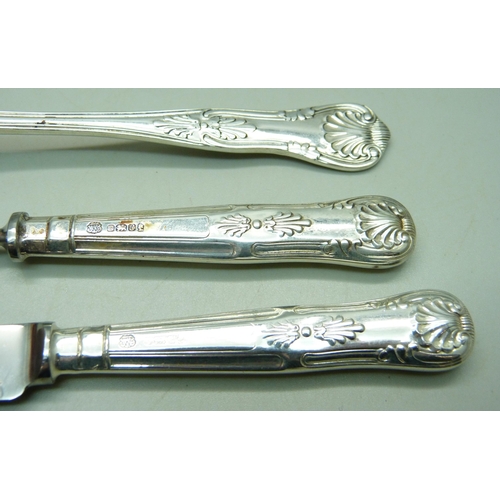 845 - A silver spoon, 63g and a silver handled pastry knife and fork