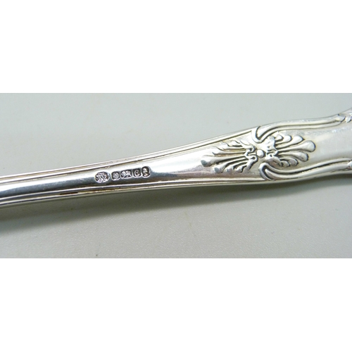 845 - A silver spoon, 63g and a silver handled pastry knife and fork