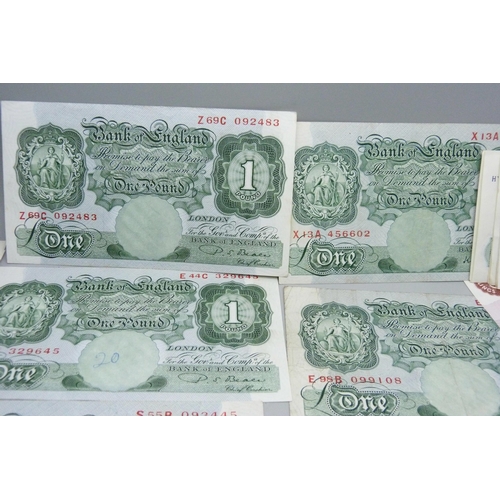 858 - Forty British £1 and ten 10 shilling banknotes