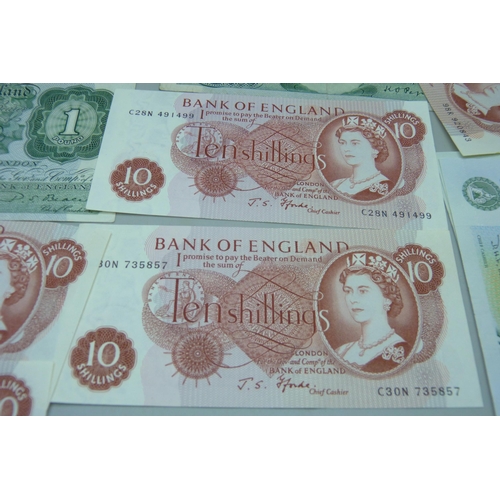 858 - Forty British £1 and ten 10 shilling banknotes