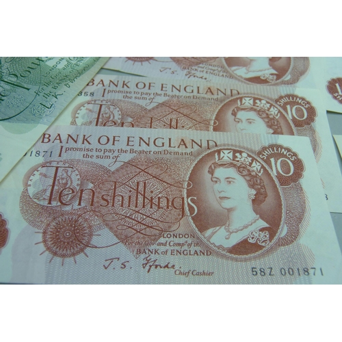 858 - Forty British £1 and ten 10 shilling banknotes