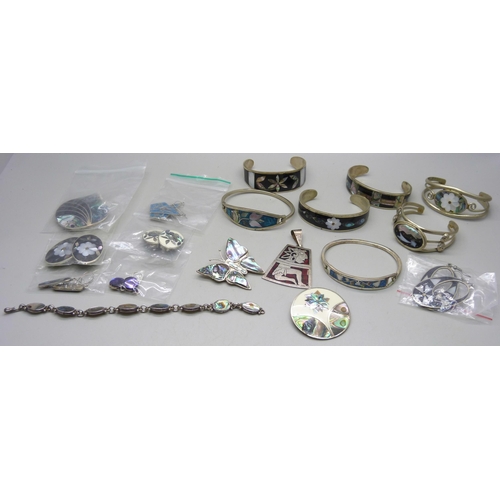 865 - A collection of silver, alpaca and other jewellery, seven bangles, seven pairs of earrings, two broo... 