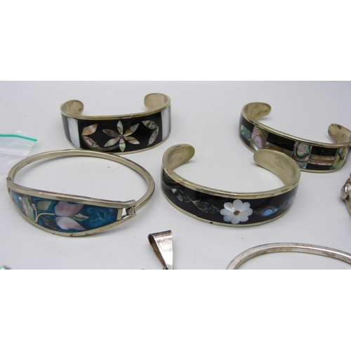 865 - A collection of silver, alpaca and other jewellery, seven bangles, seven pairs of earrings, two broo... 