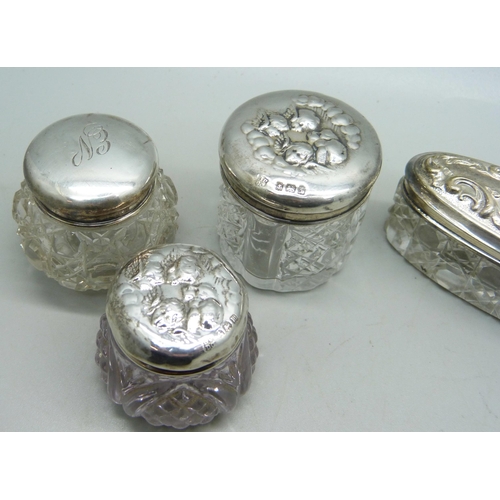 876 - Two silver top jars, Birmingham 1902 and 1907 and two others decorated with Reynolds angels