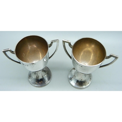 882 - A pair of silver two handled trophies, London marks, 73g