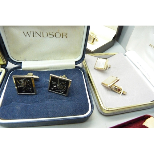 887 - A large bag of cufflinks and tie pins